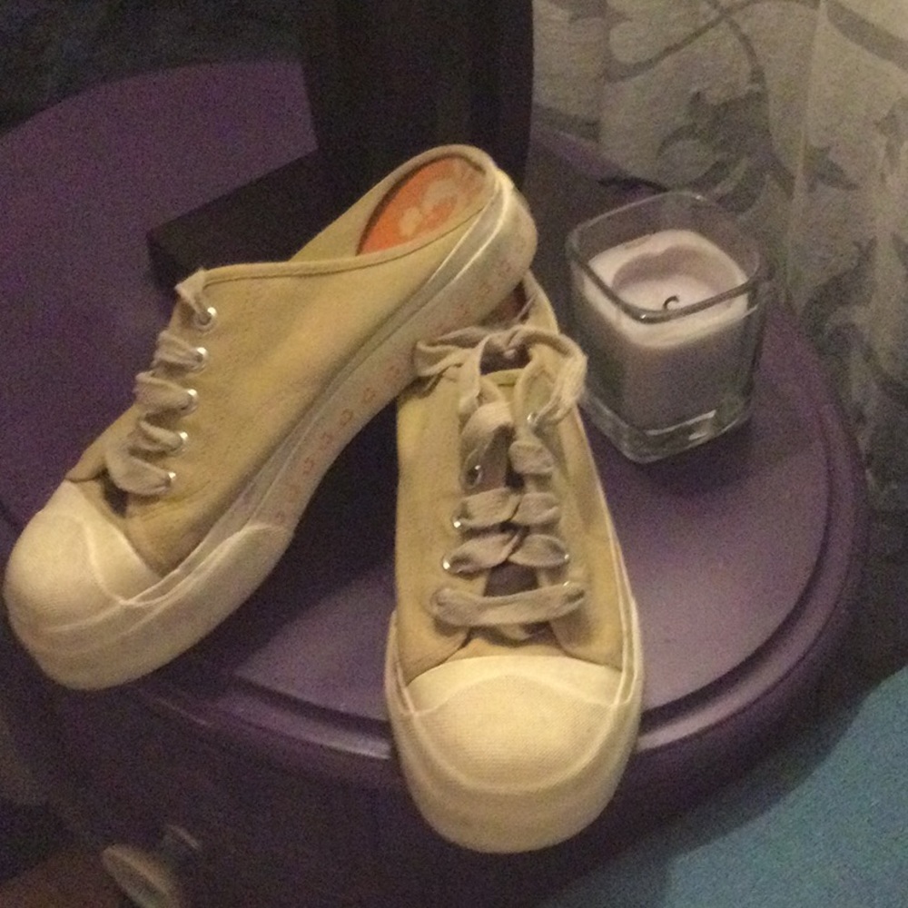 Tan coloured open back athletic shoe